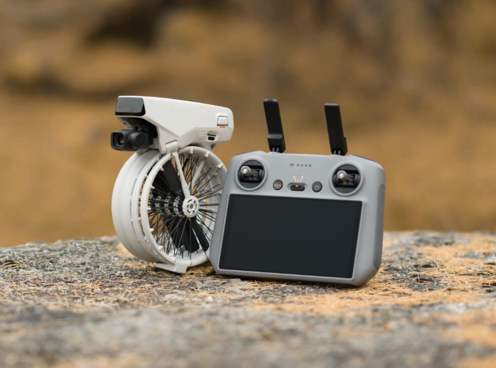 DJI Flip drone folded next to the remote control. 